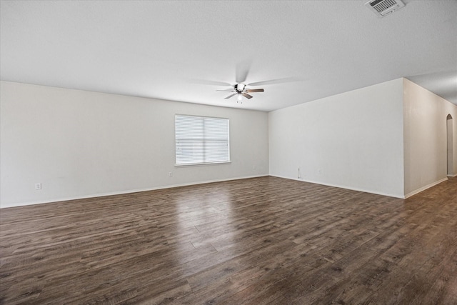330 Broken Bow, Krum, TX 76249 - unfurnished room featuring ceiling fan and dark wood-style floors