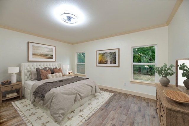 2621 Canton Dr, Fort Worth, TX 76112 - bedroom featuring ornamental molding, wood finished floors, and multiple windows