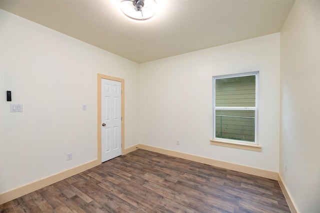 2621 Canton Dr, Fort Worth, TX 76112 - spare room featuring dark wood finished floors and baseboards