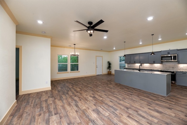 2621 Canton Dr, Fort Worth, TX 76112 - kitchen with stainless steel microwave, crown molding, a ceiling fan, dark wood-style floors, and backsplash