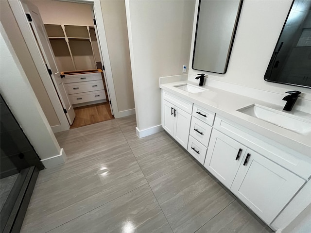 1117 Fort Worth, Grand Prairie, TX 75050 - full bath featuring double vanity, a walk in closet, and tile patterned floors