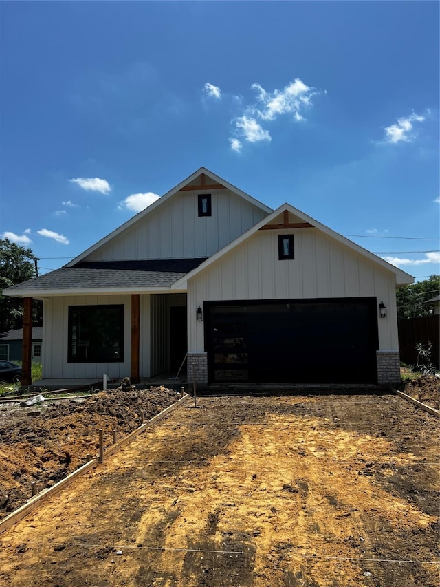 1117 Fort Worth, Grand Prairie, TX 75050 - modern farmhouse with an attached garage, driveway, brick siding, and roof with shingles