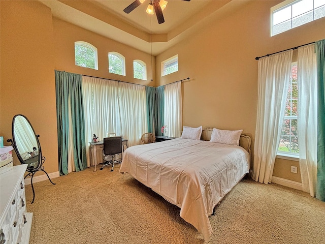14249 Fall Harvest Dr, Frisco, TX 75033 - carpeted bedroom featuring a high ceiling and a ceiling fan
