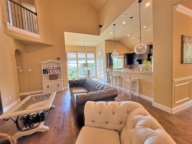 14249 Fall Harvest Dr, Frisco, TX 75033 - living room featuring wood finished floors, high vaulted ceiling, and recessed lighting
