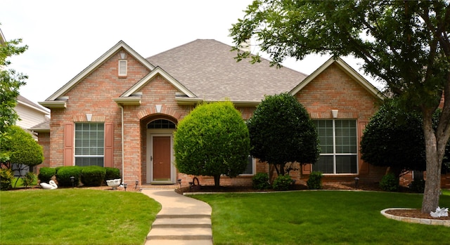 1120 Surrey Ln, Allen, TX 75013 - view of front of house with brick siding, a front lawn, and roof with shingles
