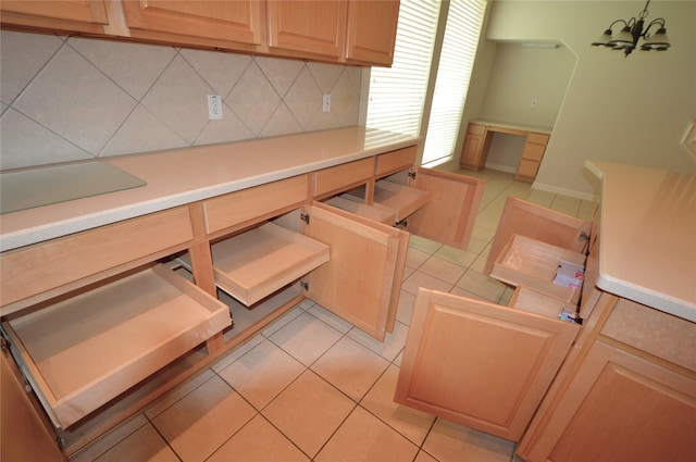 1120 Surrey Ln, Allen, TX 75013 - kitchen with tasteful backsplash, light brown cabinetry, light countertops, a chandelier, and light tile patterned floors
