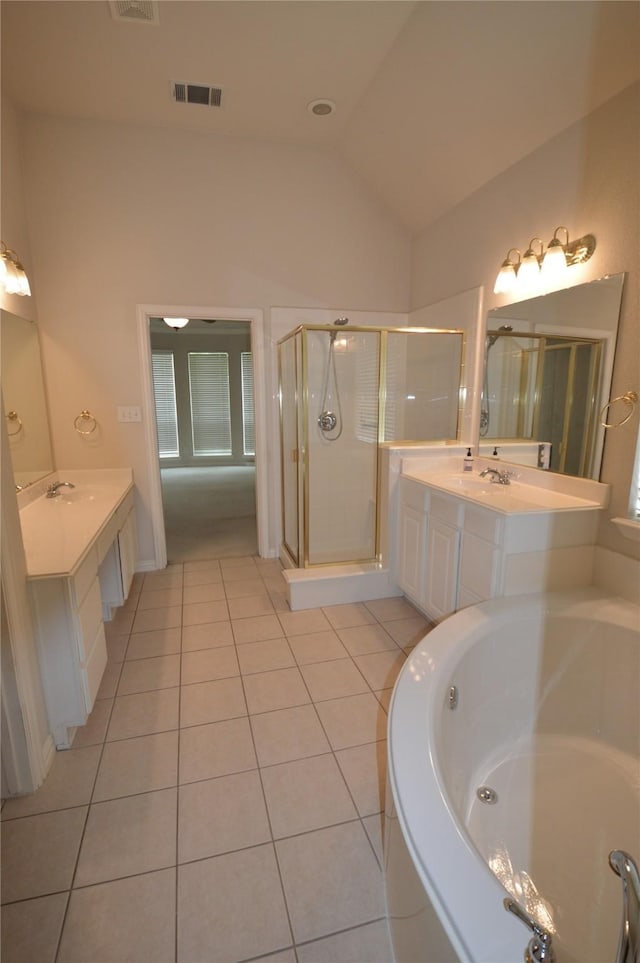 1120 Surrey Ln, Allen, TX 75013 - bathroom with tile patterned flooring, a bath, a shower stall, two vanities, and vaulted ceiling