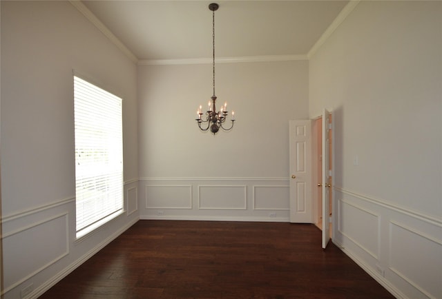 1120 Surrey Ln, Allen, TX 75013 - unfurnished dining area featuring crown molding, a chandelier, dark wood-type flooring, a wainscoted wall, and a decorative wall