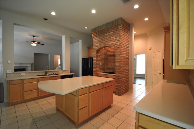 1120 Surrey Ln, Allen, TX 75013 - kitchen featuring a fireplace, light tile patterned floors, light countertops, ceiling fan, and light brown cabinetry