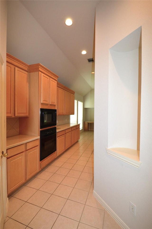 1120 Surrey Ln, Allen, TX 75013 - kitchen featuring black appliances, vaulted ceiling, light countertops, light brown cabinets, and light tile patterned floors