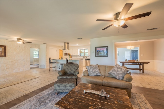 18 Tula Ct, Nocona, TX 76255 - tiled living room with a ceiling fan