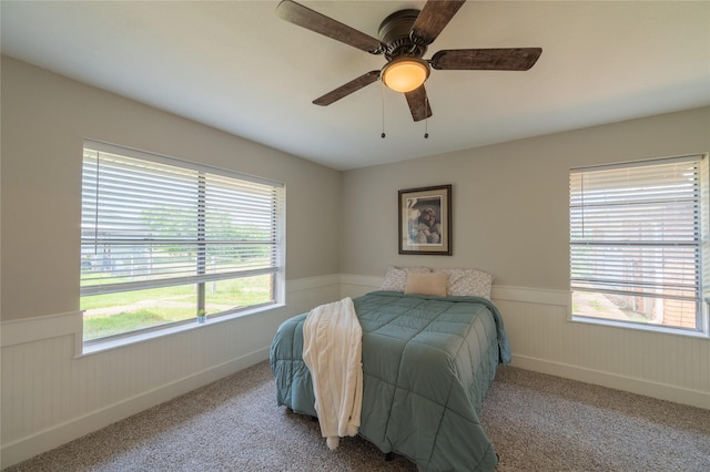 18 Tula Ct, Nocona, TX 76255 - carpeted bedroom with a wainscoted wall and ceiling fan