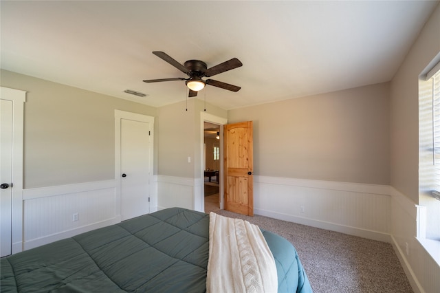 18 Tula Ct, Nocona, TX 76255 - bedroom featuring wainscoting, ceiling fan, and carpet floors