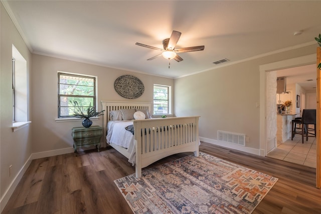 18 Tula Ct, Nocona, TX 76255 - bedroom featuring wood finished floors, crown molding, and a ceiling fan