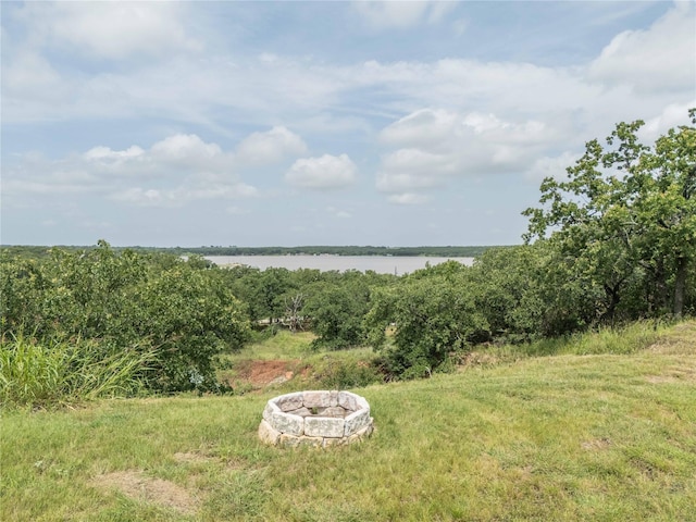 18 Tula Ct, Nocona, TX 76255 - view of yard with a water view and a fire pit
