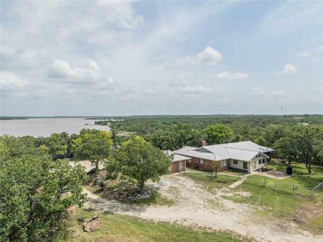 18 Tula Ct, Nocona, TX 76255 - aerial view of property and surrounding area with a nearby body of water and a heavily wooded area