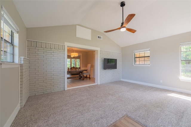 18 Tula Ct, Nocona, TX 76255 - spare room with ceiling fan, a chandelier, carpet flooring, and high vaulted ceiling