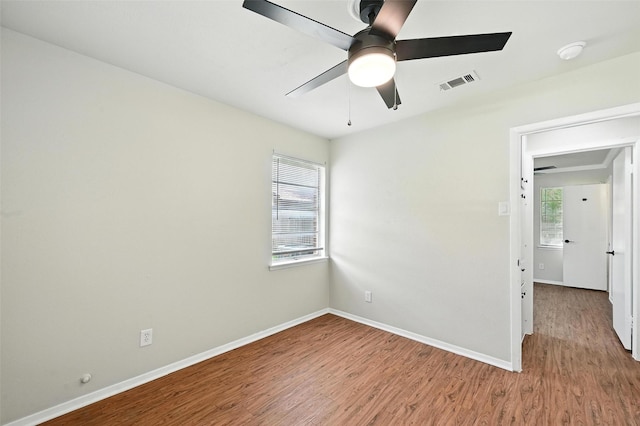 324 Jasmine Ct, Burleson, TX 76028 - spare room with wood finished floors, a ceiling fan, and a smoke detector