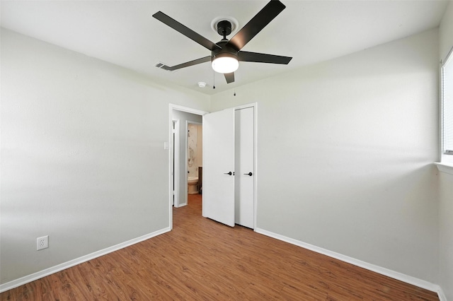 324 Jasmine Ct, Burleson, TX 76028 - unfurnished bedroom featuring wood finished floors, a closet, and ceiling fan