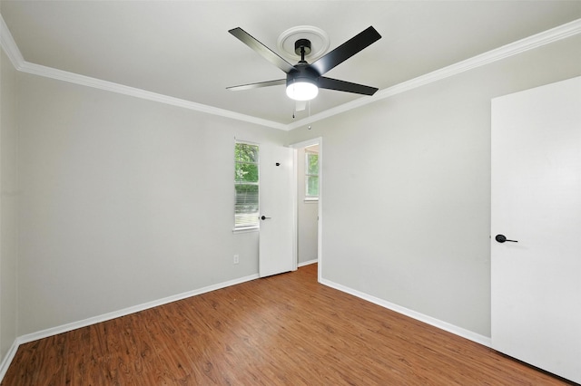 324 Jasmine Ct, Burleson, TX 76028 - empty room with wood finished floors, a ceiling fan, and ornamental molding