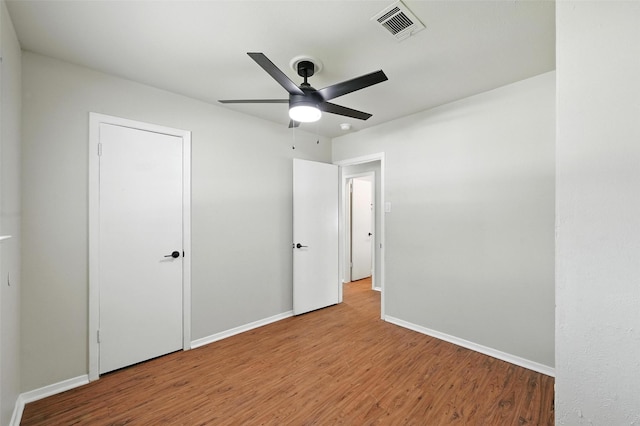324 Jasmine Ct, Burleson, TX 76028 - unfurnished bedroom featuring wood finished floors and a ceiling fan