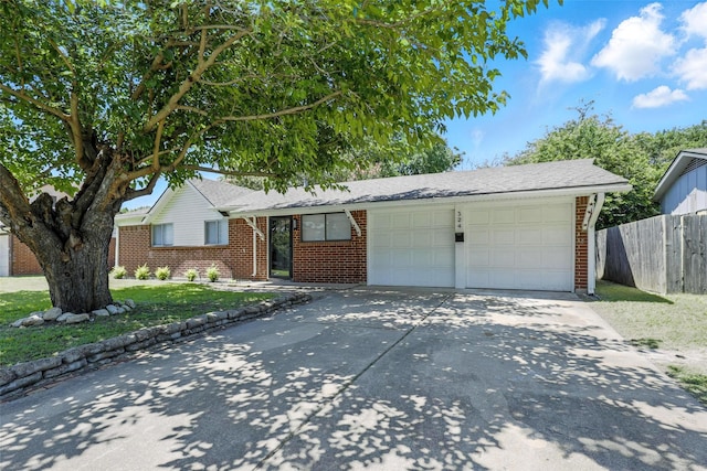 324 Jasmine Ct, Burleson, TX 76028 - single story home featuring brick siding, an attached garage, and driveway