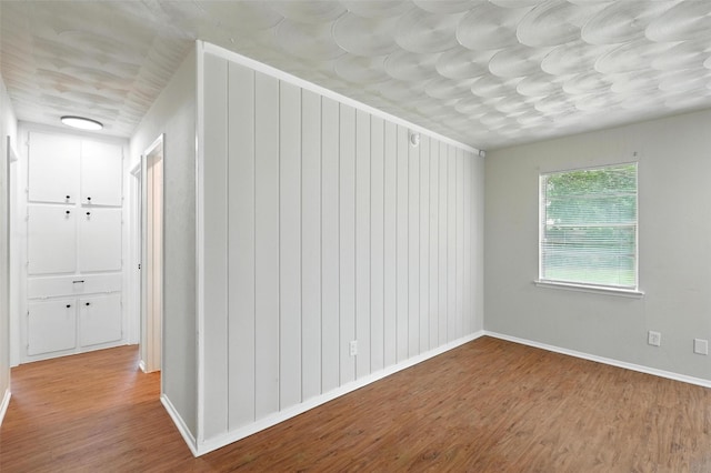 324 Jasmine Ct, Burleson, TX 76028 - unfurnished room with wood finished floors and baseboards