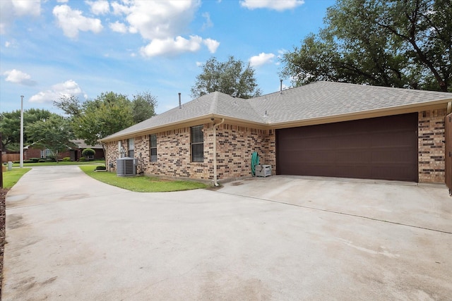 1112 Indian Ridge Dr, Denton, TX 76205 - view of front of property with driveway, brick siding, a garage, and roof with shingles