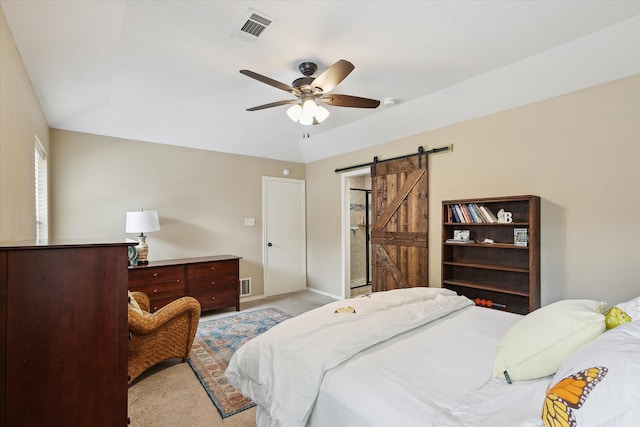 1112 Indian Ridge Dr, Denton, TX 76205 - bedroom with a barn door, light carpet, and a ceiling fan