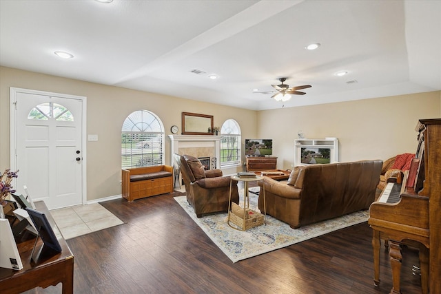 1112 Indian Ridge Dr, Denton, TX 76205 - living room with a tile fireplace, plenty of natural light, dark wood-style flooring, a ceiling fan, and recessed lighting