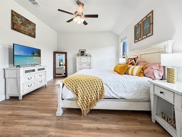 3978 Sidney Ln, Heath, TX 75126 - bedroom with lofted ceiling, wood finished floors, and a ceiling fan