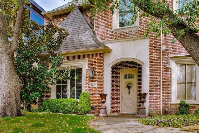 4139 Herschel Ave, Dallas, TX 75219 - view of exterior entry with brick siding and roof with shingles