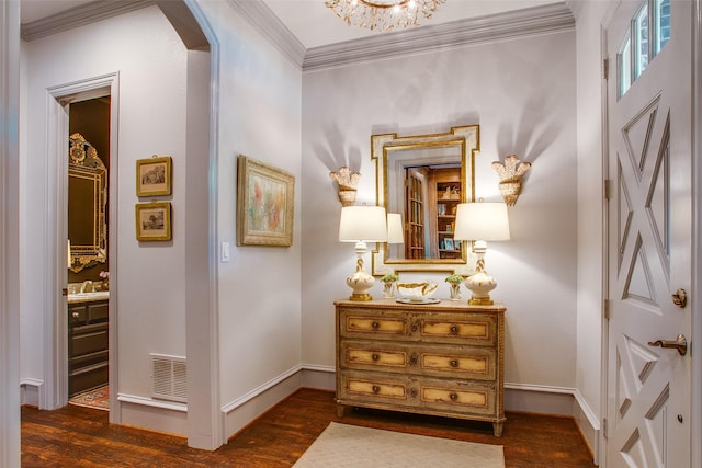 4139 Herschel Ave, Dallas, TX 75219 - hall with arched walkways, dark wood finished floors, ornamental molding, and a chandelier