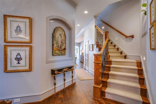 4139 Herschel Ave, Dallas, TX 75219 - stairs featuring recessed lighting, wood finished floors, and crown molding