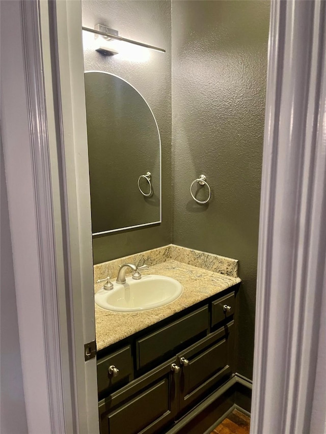 4139 Herschel Ave, Dallas, TX 75219 - bathroom with vanity and a textured wall