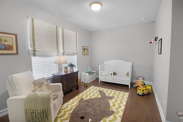 717 Freedom Ln, Aubrey, TX 76227 - bedroom with wood finished floors and a crib