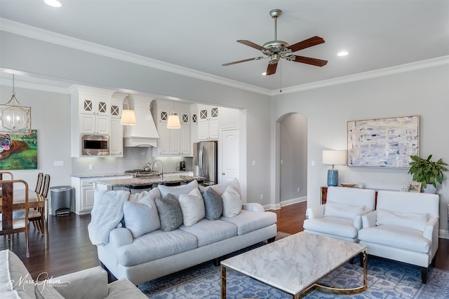 1101 Cypress Creek Cir, Shreveport, LA 71106 - living room featuring dark wood finished floors, a ceiling fan, arched walkways, ornamental molding, and recessed lighting