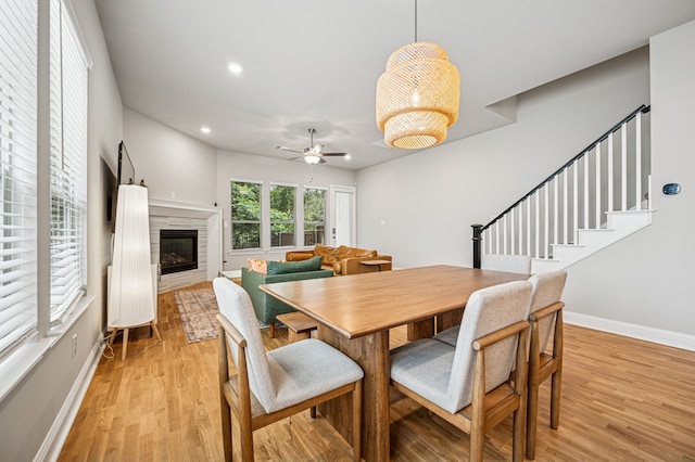 420 Waterscape Dr Unit 1237, Lake Dallas, TX 75065 - dining space with a ceiling fan, light wood-style flooring, recessed lighting, a glass covered fireplace, and stairway