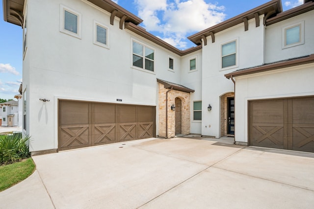 420 Waterscape Dr Unit 1237, Lake Dallas, TX 75065 - view of front of property with an attached garage, stucco siding, and driveway