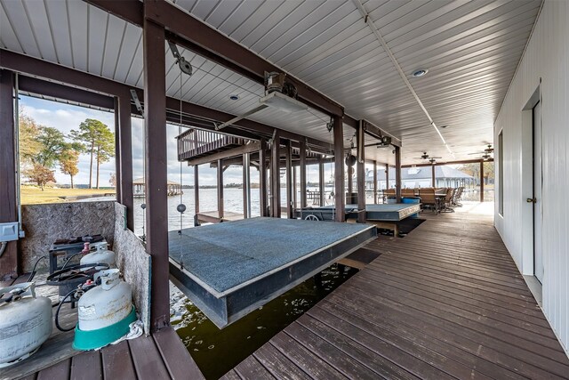 17726 Southpoint, Whitehouse, TX 75791 - wooden deck featuring boat lift, a dock, a water view, and outdoor dining space