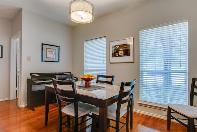18423 Rain Dance Trl, Dallas, TX 75252 - dining area featuring light wood-style floors and baseboards