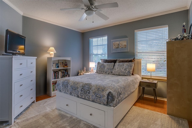 18423 Rain Dance Trl, Dallas, TX 75252 - bedroom with light wood-style flooring, crown molding, a textured ceiling, and a ceiling fan