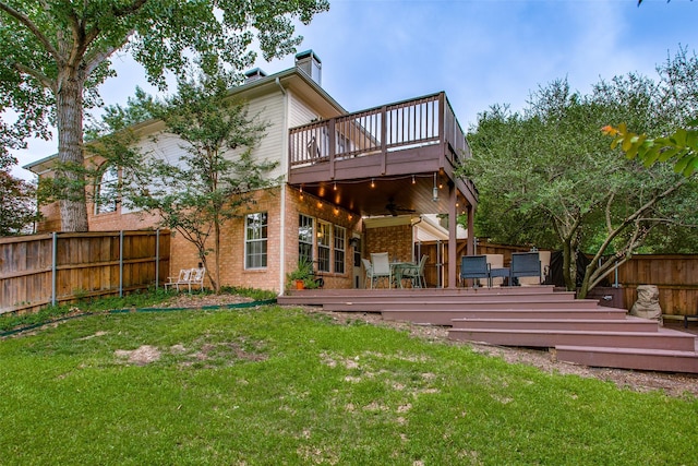 18423 Rain Dance Trl, Dallas, TX 75252 - back of house with ceiling fan, a fenced backyard, brick siding, a deck, and a chimney