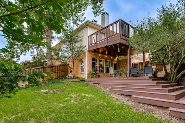 18423 Rain Dance Trl, Dallas, TX 75252 - back of house featuring a fenced backyard, brick siding, a chimney, and a deck