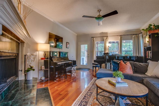 18423 Rain Dance Trl, Dallas, TX 75252 - living area with a textured ceiling, a ceiling fan, crown molding, and wood finished floors