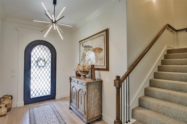 1001 Quarry Ct, Granbury, TX 76048 - foyer featuring a chandelier, ornamental molding, light wood finished floors, and stairs