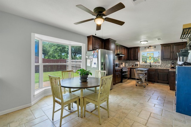 845 Griffith Ave, Terrell, TX 75160 - dining space with a ceiling fan and stone tile floors