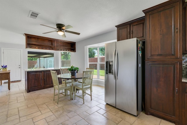 845 Griffith Ave, Terrell, TX 75160 - dining room with ceiling fan and stone tile floors