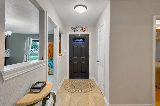 845 Griffith Ave, Terrell, TX 75160 - entryway featuring light tile patterned flooring and a textured ceiling