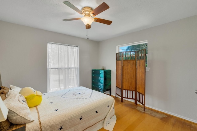 845 Griffith Ave, Terrell, TX 75160 - bedroom with light wood-style flooring and a ceiling fan